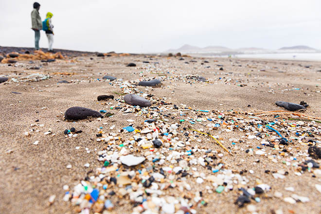 Multicoloured plastoc pellets and other micrplastics littered on the shore of a beach in Lanzarote, Canary Islands, Spain.