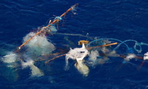 Discarded fishing gear floats in the ocean.